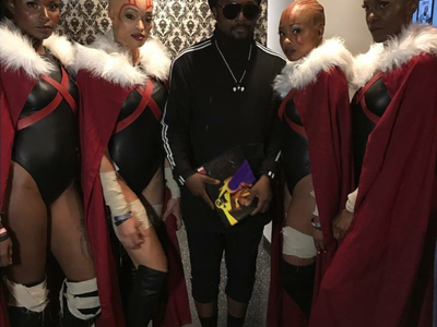 These are Dora Milaje costumes created by Castle Corsetry for Marvel Comics, seen here with Will.I.Iam from the Black Eye Peas.	