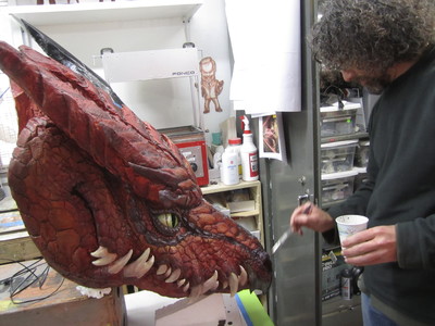 This is sculptor Robert Barnes working on our cyborg dragon with glowing eyes and smoke effects that was designed and fabricated for the Sword and Laser show on the Geek and Sundry channel. 	