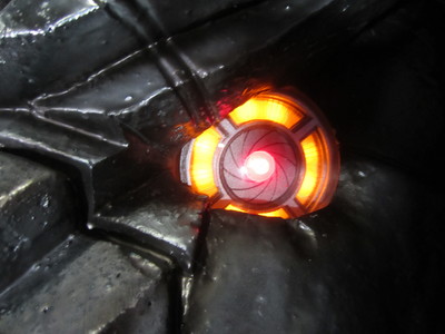 This is one side of the cyborg dragon with glowing eyes and smoke effects was designed and fabricated for the Sword and Laser show on the Geek and Sundry channel. 	