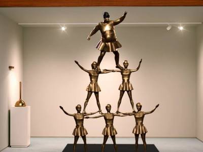 This is a 1/12 scale miniature falling cheerleader brass statue we created for Farmers Insurance for their Hall of Claims ad campaigns. 	