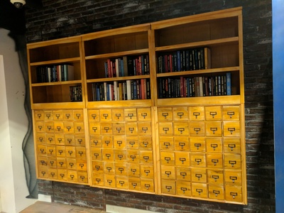We designed and fabricated these apothecary cabinets with a hidden, secret, personnel door for the Niantic themed lobby in San Francisco.	