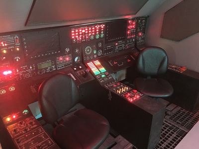 Our space ship set is reconfigurable to suit your specific needs; shown here is the cockpit with interactive lights and rotating chairs.	