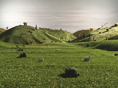 This is a forced perspective, grassy hills set with a painted sky backdrop that we created for Netflix's show, the White Rabbit Project. ttps://youtu.be/ohb5k3_vQcE	